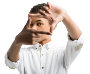 A young man holding his hands out in front of him, with the forefingers and thumbs pressed together to make a frame.