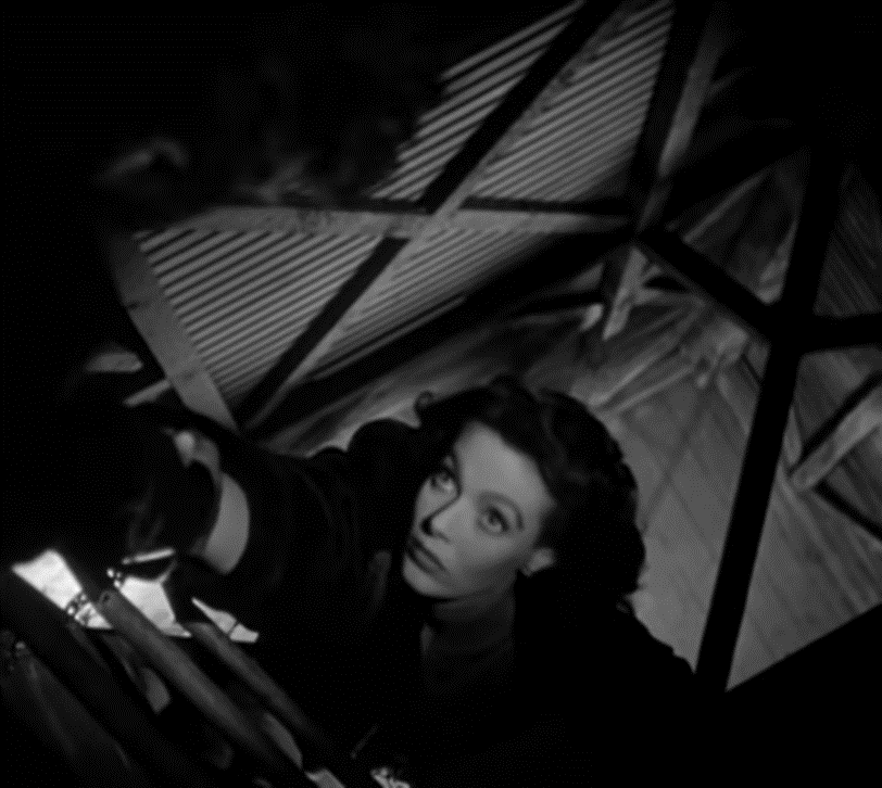 A high-angle shot of a woman climbing a ladder